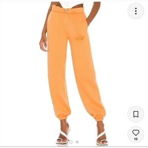 Small orange boys lie sweatpants
